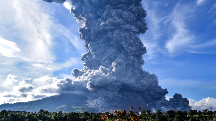 Sinabung Volcano Erupts In Karo, Indonesia, Erupts A Towering Column Of Ash